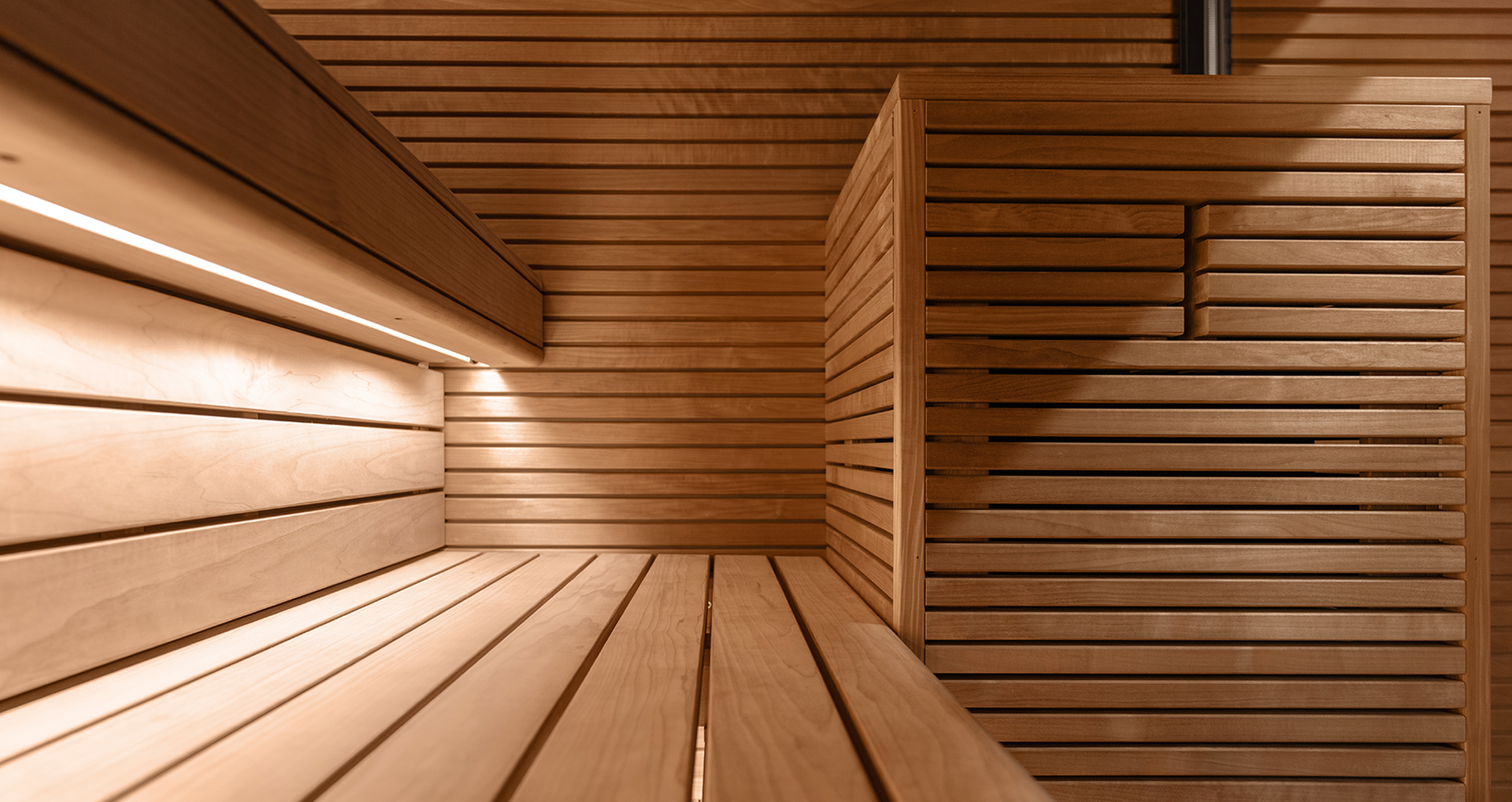 Wooden sauna interior with warm lighting