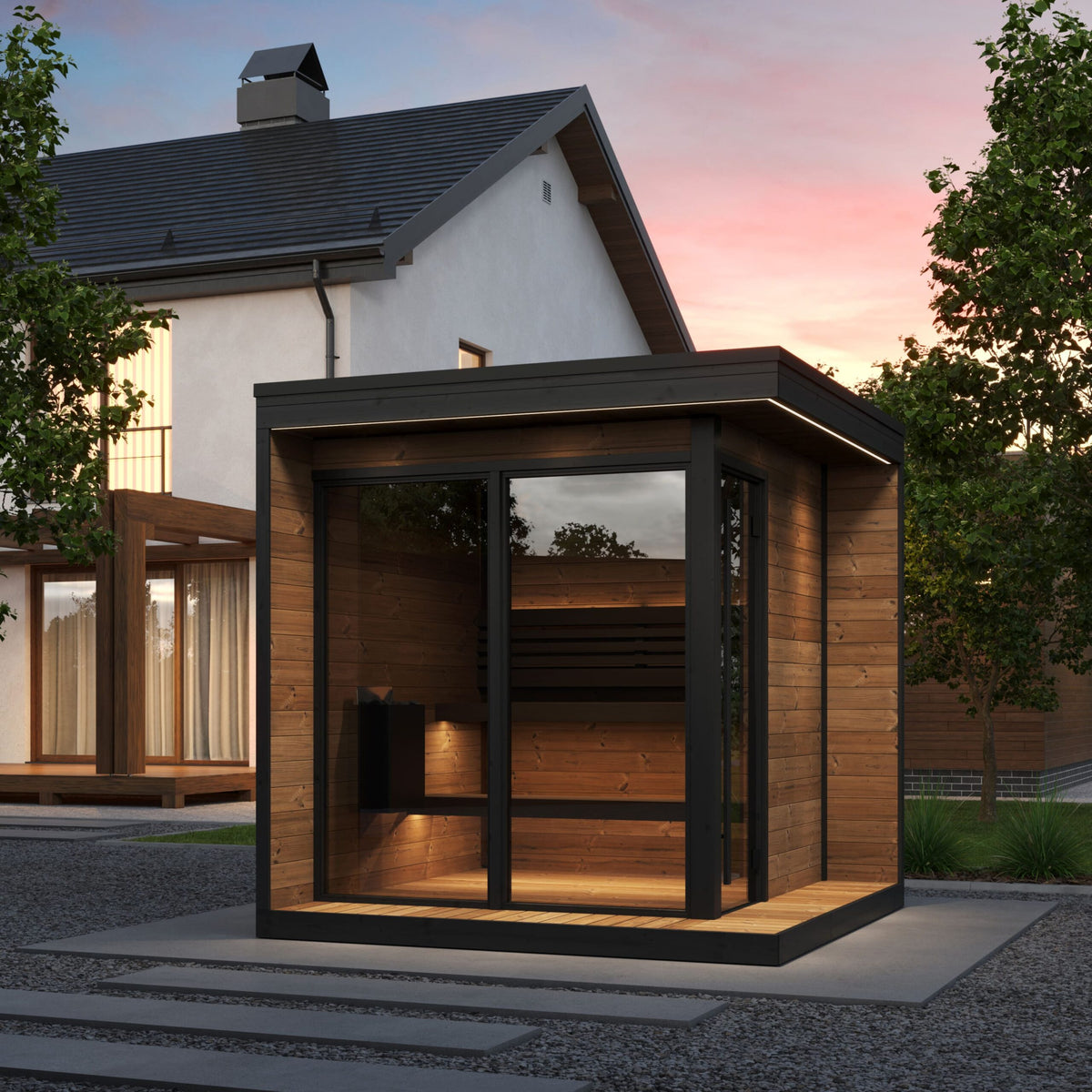 SaunaLife GL6 outdoor sauna in a backyard at dusk with exterior LED lighting
