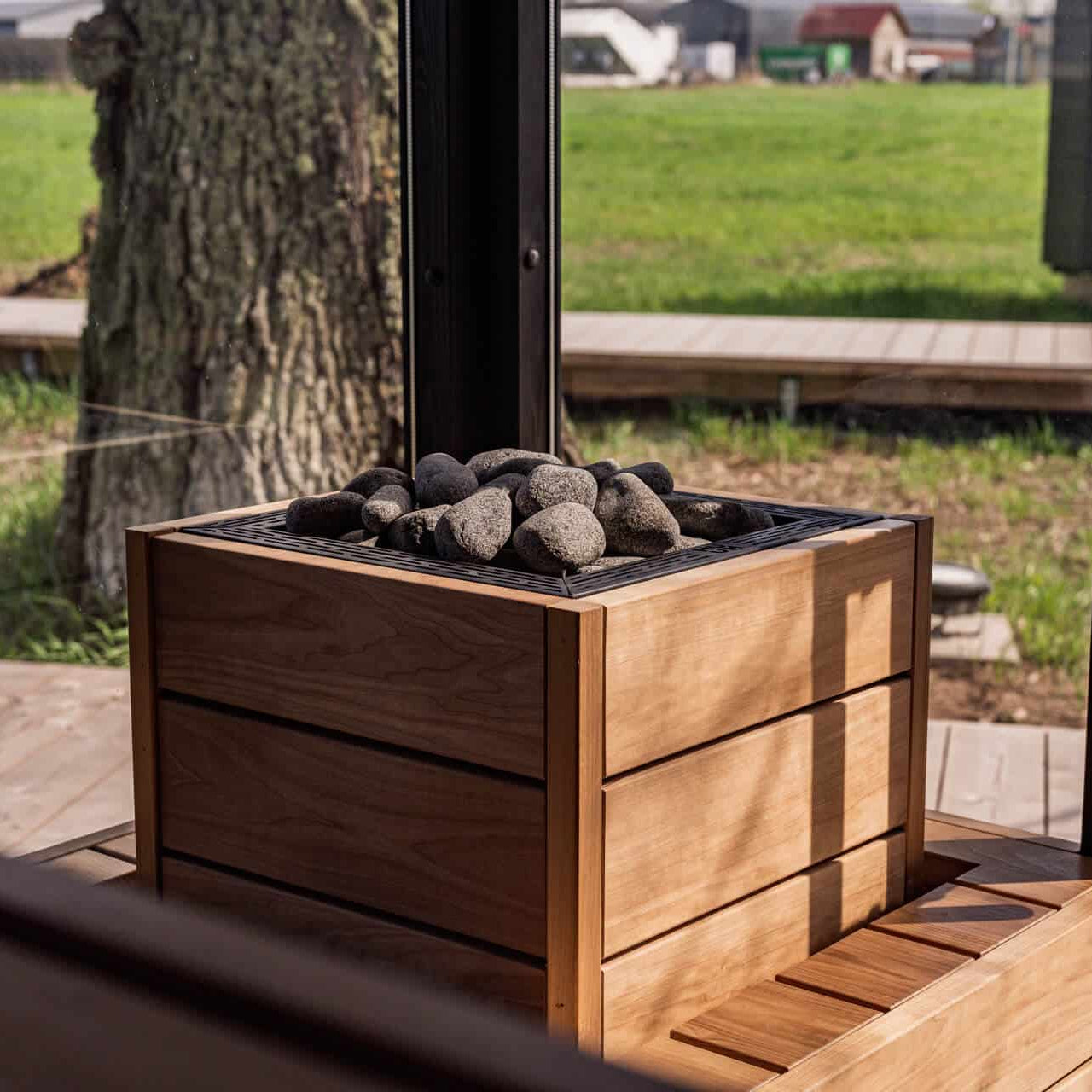 Wooden planter box with rocks on a deck