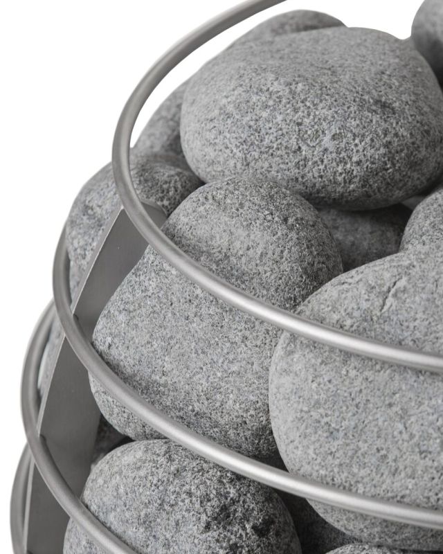 Gray pebbles in a metal basket on a white background