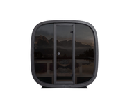 Black electronic device with reflective surface showing a scenic reflection