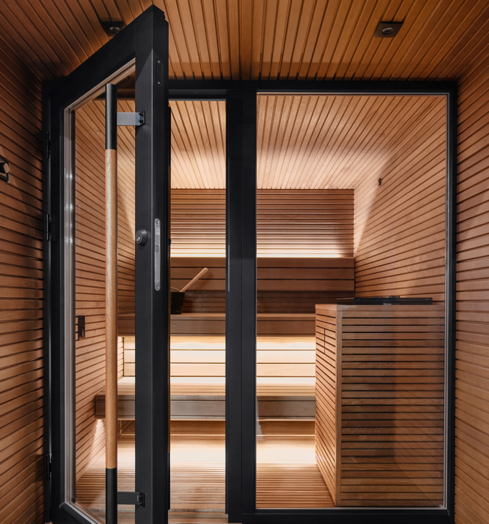Wooden sauna interior with glass door